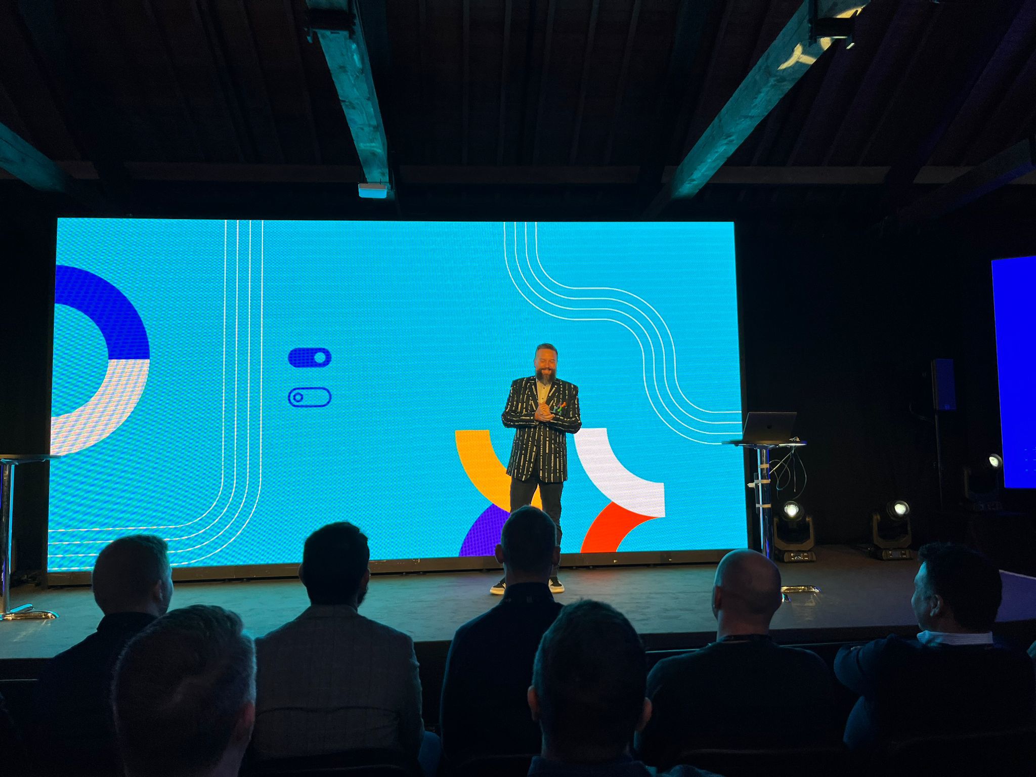 Justin Anovick presenting on stage